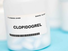 bottle filled with tablets and Clopidogrel